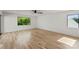 Spacious bedroom with hardwood floors and large windows at 721 Charles Ave, Charlotte, NC 28205