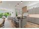Beautiful kitchen with large island, bar seating and an open concept layout to the living spaces at 721 Charles Ave, Charlotte, NC 28205