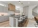 Well-lit kitchen featuring a large island with seating and modern appliances at 721 Charles Ave, Charlotte, NC 28205