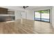 Spacious living room with hardwood floors, wet bar, and sliding glass doors at 721 Charles Ave, Charlotte, NC 28205