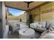 Covered patio area with comfortable seating and outdoor living space at 721 Charles Ave, Charlotte, NC 28205