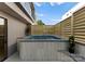 Modern backyard pool surrounded by privacy fence and lush landscaping at 721 Charles Ave, Charlotte, NC 28205