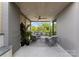 Covered porch with comfortable seating, perfect for relaxing and entertaining outdoors at 721 Charles Ave, Charlotte, NC 28205