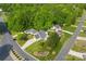 Aerial view highlighting a well-maintained lawn, mature trees, and the location of this property within the neighborhood at 7239 Oxford Hunt Dr, Stanley, NC 28164