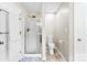 This is a bathroom with a toilet and a shower with a glass door at 7239 Oxford Hunt Dr, Stanley, NC 28164