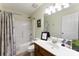 This is a bathroom featuring a vanity, a toilet, and a shower-tub combo at 7239 Oxford Hunt Dr, Stanley, NC 28164