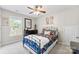 Cozy bedroom with lots of natural light, ceiling fan, and comfortable queen size bed at 7239 Oxford Hunt Dr, Stanley, NC 28164