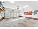 Spacious garage with roll-up door and ample storage space at 7239 Oxford Hunt Dr, Stanley, NC 28164