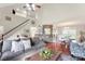 Sun-drenched living space with hardwood floors, vaulted ceiling, and stylish decor, perfect for entertaining and relaxation at 7239 Oxford Hunt Dr, Stanley, NC 28164