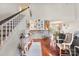 A spacious living area featuring high ceilings and a stone accent wall creates a welcoming and stylish atmosphere at 7239 Oxford Hunt Dr, Stanley, NC 28164