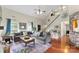 This living room has vaulted ceilings, wood floors, and a large, comfortable sectional sofa at 7239 Oxford Hunt Dr, Stanley, NC 28164