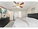 Main bedroom features a ceiling fan, hardwood floors, and access to an ensuite bathroom at 7239 Oxford Hunt Dr, Stanley, NC 28164