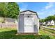 Exterior view of shed on a well maintained lawn at 7239 Oxford Hunt Dr, Stanley, NC 28164