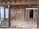 Covered back porch with brick supports and a concrete floor, providing an outdoor space at 7527 Old Shelby Rd, Vale, NC 28168