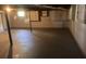 Spacious unfinished basement with concrete floor and some storage at 7527 Old Shelby Rd, Vale, NC 28168