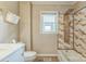 Bathroom featuring a shower and tub combination with modern fixtures, toilet and sink at 7527 Old Shelby Rd, Vale, NC 28168