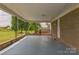 Spacious carport area featuring a durable concrete floor and access to the main house at 7527 Old Shelby Rd, Vale, NC 28168
