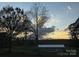 Pastoral acreage property at sunset with outbuilding structure at 7527 Old Shelby Rd, Vale, NC 28168