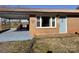 Welcoming brick home with light blue door and covered carport, enhancing curb appeal at 7527 Old Shelby Rd, Vale, NC 28168