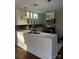 Bright kitchen with white cabinets, a marble countertop island, and pendant lighting at 7527 Old Shelby Rd, Vale, NC 28168