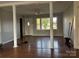 Bright living room with hardwood floors and decorative columns at 7527 Old Shelby Rd, Vale, NC 28168