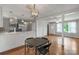Open-concept living area with hardwood floors, natural light, and view into the kitchen at 7527 Old Shelby Rd, Vale, NC 28168