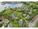 Stunning aerial view of a lakefront neighborhood with lush landscaping and a community boat dock at 7626 Vistaview Dr, Cornelius, NC 28031