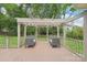Backyard highlighting an outdoor seating area with a pergola and comfortable chairs, perfect for relaxation at 7626 Vistaview Dr, Cornelius, NC 28031