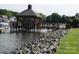 Tranquil community pier featuring gazebo and picturesque lake views at 7626 Vistaview Dr, Cornelius, NC 28031