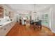 Bright kitchen with a breakfast bar, hardwood floors, modern appliances and a view to dining room at 7626 Vistaview Dr, Cornelius, NC 28031