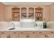 Bright kitchen with quartz countertop, wooden cabinets, and under-cabinet lighting at 7626 Vistaview Dr, Cornelius, NC 28031