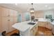 Spacious kitchen with island gas cooktop, stainless appliances, and ample cabinet space at 7626 Vistaview Dr, Cornelius, NC 28031