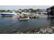 Community marina with jet skis and boats on lifts, offering lakeside enjoyment at 7626 Vistaview Dr, Cornelius, NC 28031