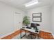 Cozy home office space with natural light, desk, and wood floors at 7626 Vistaview Dr, Cornelius, NC 28031