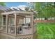 Inviting covered patio with stylish seating and beautiful views of the lush backyard at 7626 Vistaview Dr, Cornelius, NC 28031