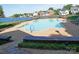 Community pool area with lounge chairs, tables, and waterfront views at 7626 Vistaview Dr, Cornelius, NC 28031