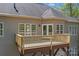 Elevated wooden deck featuring a neutral siding and a classic railing at 7748 Long Bay Pkwy, Catawba, NC 28609