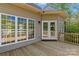 View of the wooden deck area with windows and a glass door at 7748 Long Bay Pkwy, Catawba, NC 28609