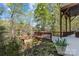 A backyard deck leads into a mature wooded area at 7748 Long Bay Pkwy, Catawba, NC 28609