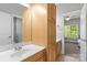Bathroom sink, cabinetry, and view to bedroom beyond at 7748 Long Bay Pkwy, Catawba, NC 28609