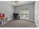 Bedroom featuring ceiling fan, desk, and a small dollhouse at 7748 Long Bay Pkwy, Catawba, NC 28609