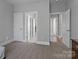 Bedroom with carpeted floors, and hallways to other rooms at 7748 Long Bay Pkwy, Catawba, NC 28609