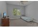 Bedroom with neutral walls, carpet, and view to the backyard at 7748 Long Bay Pkwy, Catawba, NC 28609