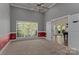 Large bonus room with carpet, and a view into game room at 7748 Long Bay Pkwy, Catawba, NC 28609