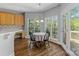 Charming dining area featuring a chandelier, large windows with a view, and hardwood floors at 7748 Long Bay Pkwy, Catawba, NC 28609