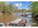 Waterfront dock with a boat and lift at 7748 Long Bay Pkwy, Catawba, NC 28609