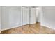 This bedroom offers ample closet space, hardwood floors and neutral paint at 801 Bilmark Ave, Charlotte, NC 28213