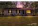 Inviting home exterior with manicured lawn, and an inviting entry for a warm ambiance at 801 Bilmark Ave, Charlotte, NC 28213