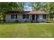 Charming one-story home with a well-manicured lawn and freshly painted exterior at 801 Bilmark Ave, Charlotte, NC 28213