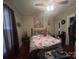 Cozy bedroom with a large bed, ceiling fan and hardwood floors at 829 Green St, Salisbury, NC 28144